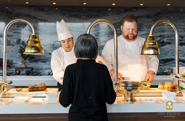 Chefs serving woman